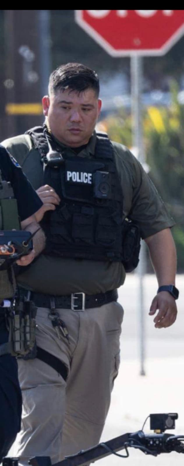 Adan on duty in his police gear