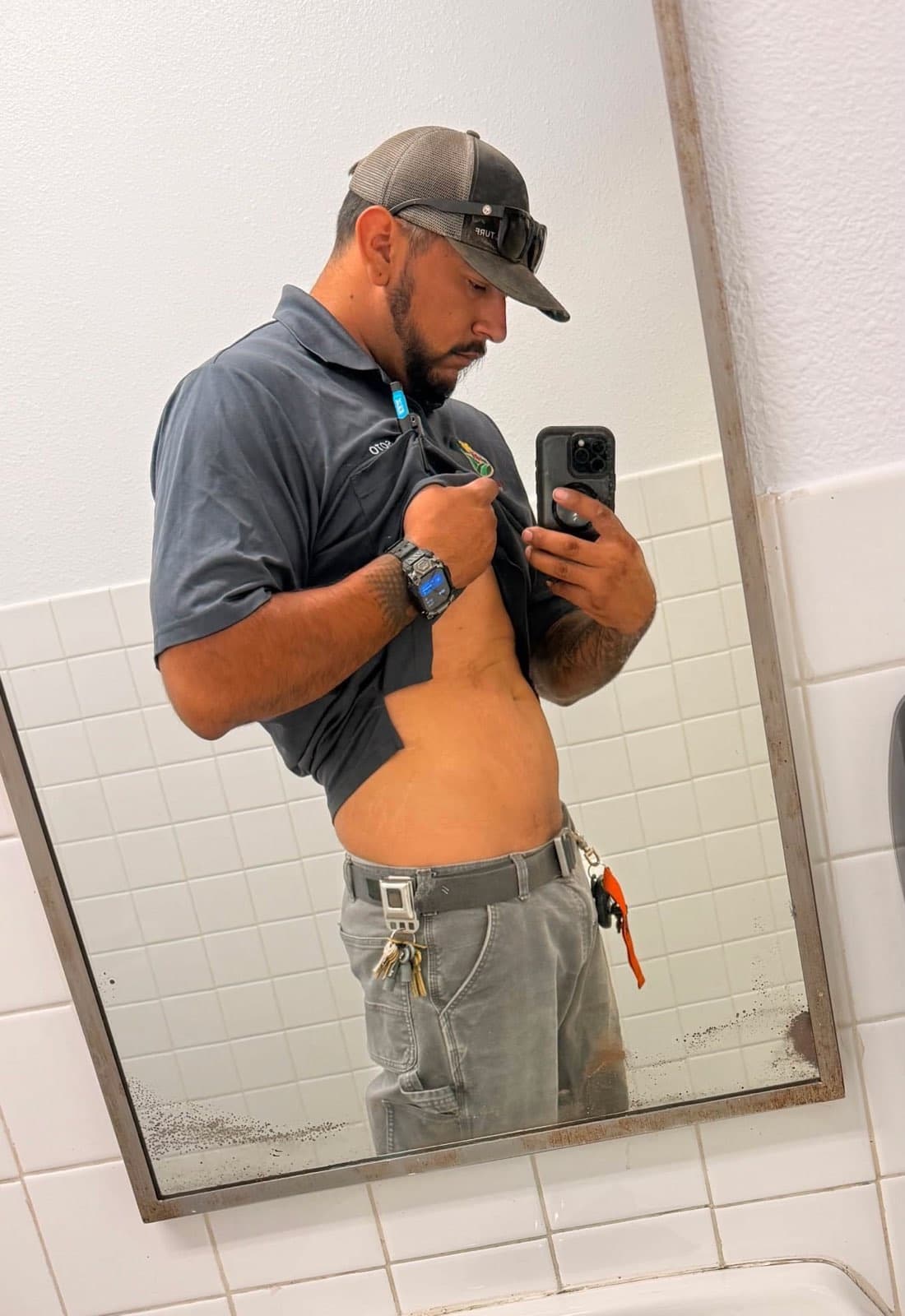 Dave on a work break, checking his progress in the mirror
